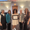 Julia Lalla (center) flanked by Sr. Liceria, St. Joseph Hill Academy, Student Coordinator, Principal Mrs. Maria Molluzzo, Gale Strassberg, North Shore Rotary Scholarship Committee Chair, and Diane Arneth, Club President during the scholarship presentation.