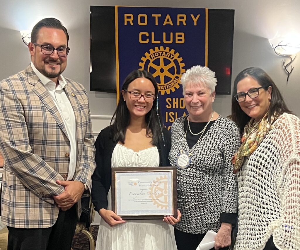 Evangeline Carolan (center) flanked by Dennis Surmanek, Club President, Gale Strassberg, North Shore Rotary Scholarship Committee Chair, and Suzanne Demetrio, Club Past President during the scholarship presentation.