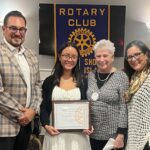 Evangeline Carolan (center) flanked by Dennis Surmanek, Club President, Gale Strassberg, North Shore Rotary Scholarship Committee Chair, and Suzanne Demetrio, Club Past President during the scholarship presentation.